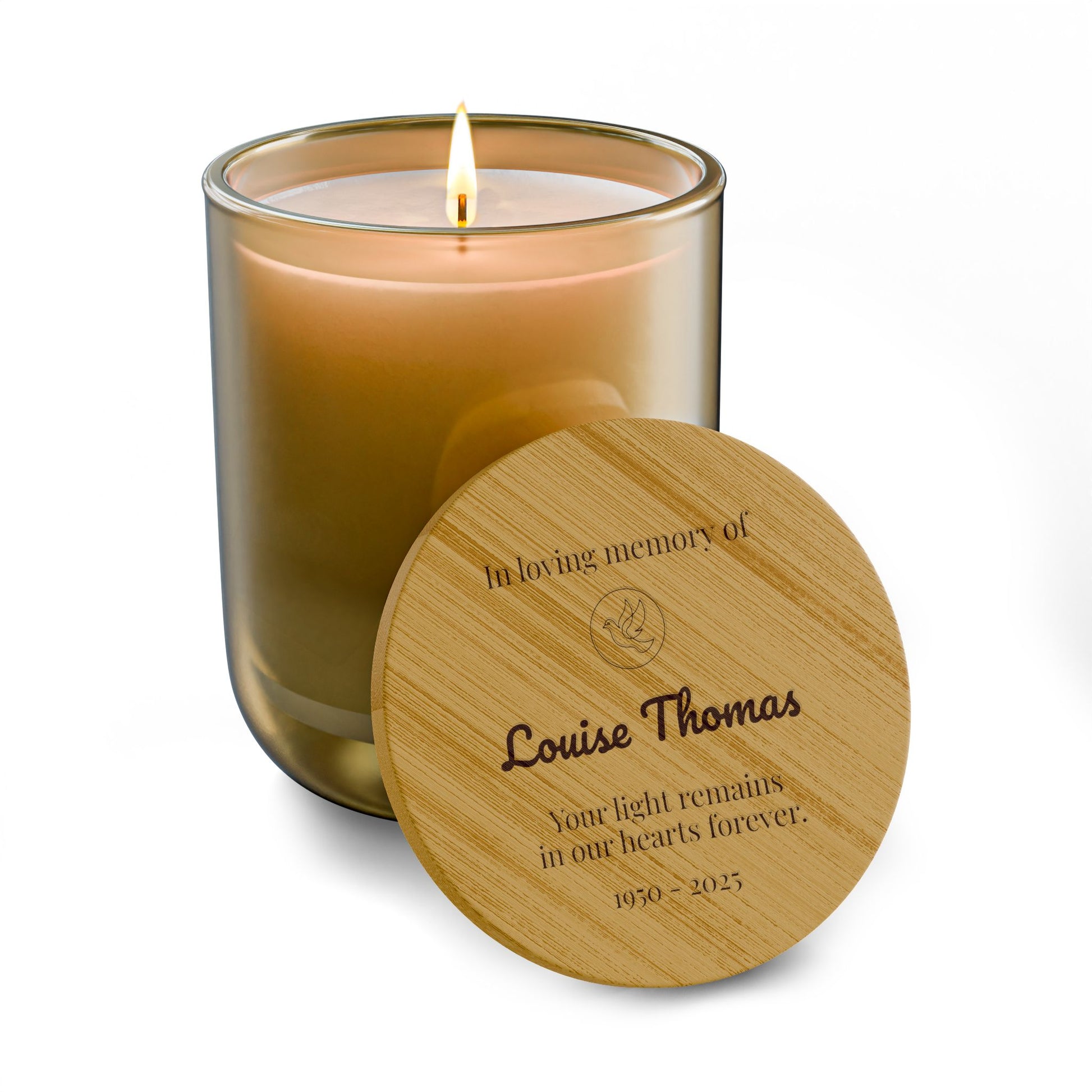 Candle with a wooden lid engraved with a message of remembrance on a white background