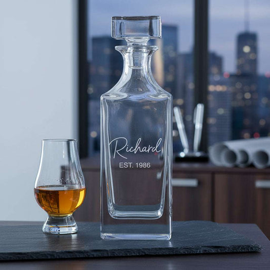 Clear glass decanter with engraved name and year 