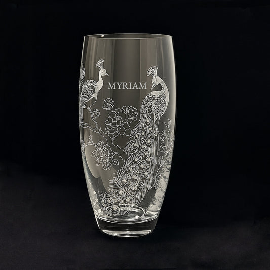 Clear glass vase with engraved peacock design and 'NAME' text 