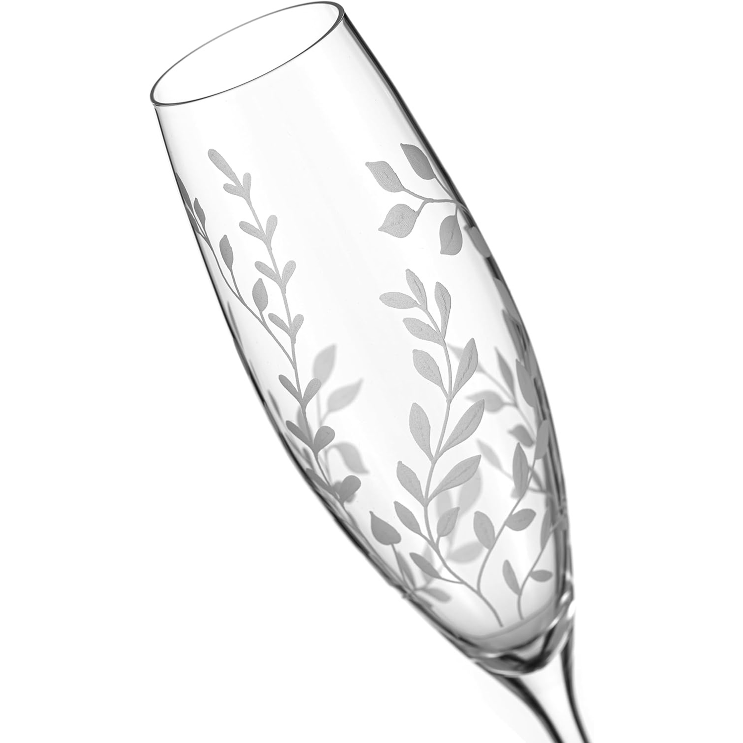 Clear glass flute with leaf pattern on a white background