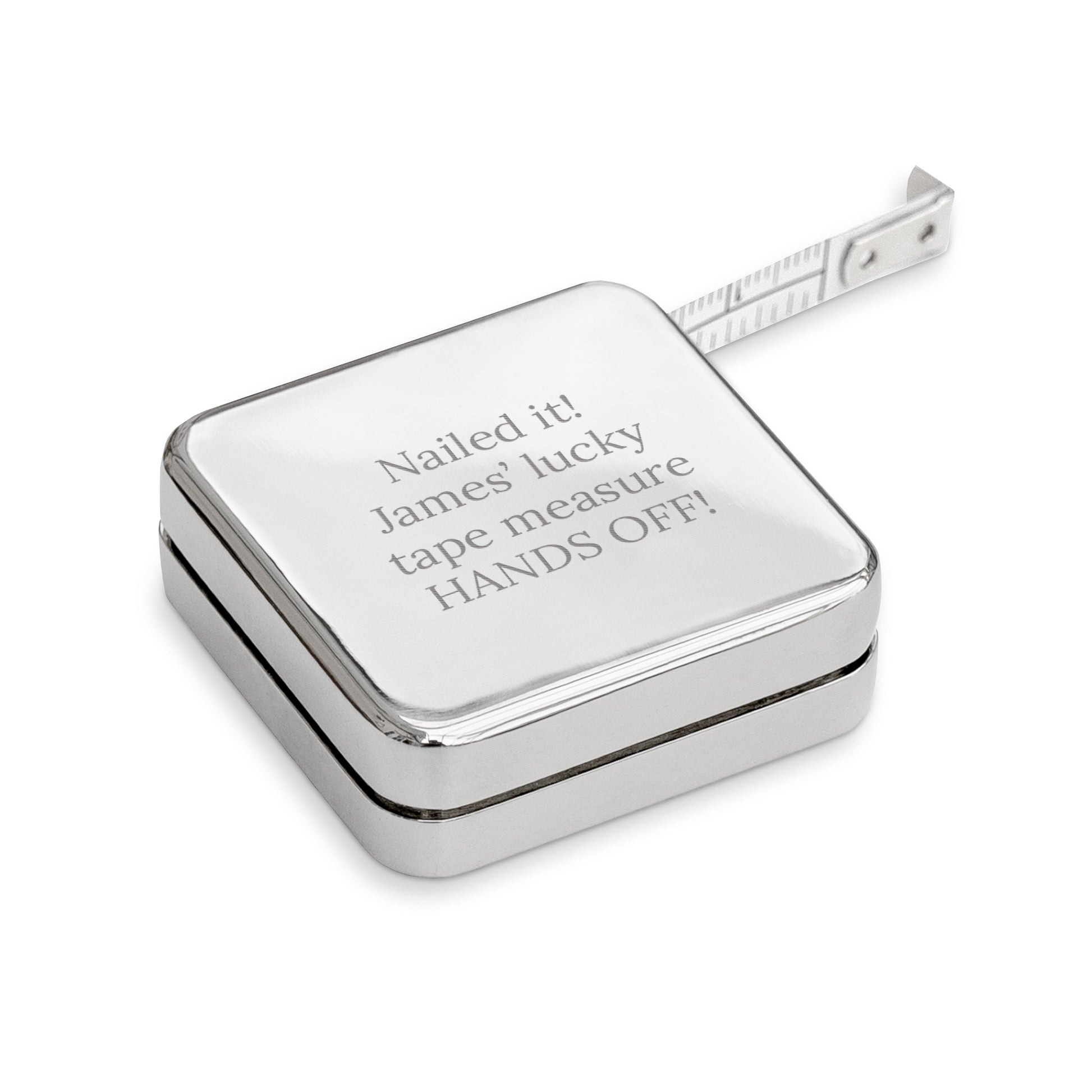Silver tape measure with engraved text on a white background