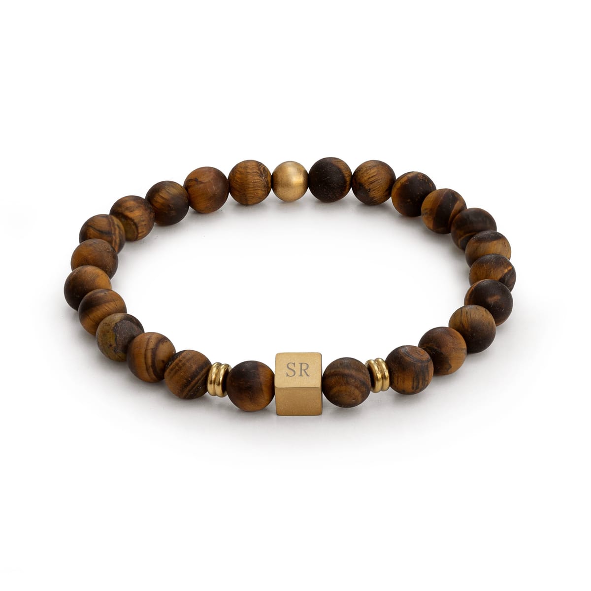 A beaded bracelet made of brown tiger's eye beads with a central gold cube charm engraved with initials, flanked by small gold spacer beads, 
