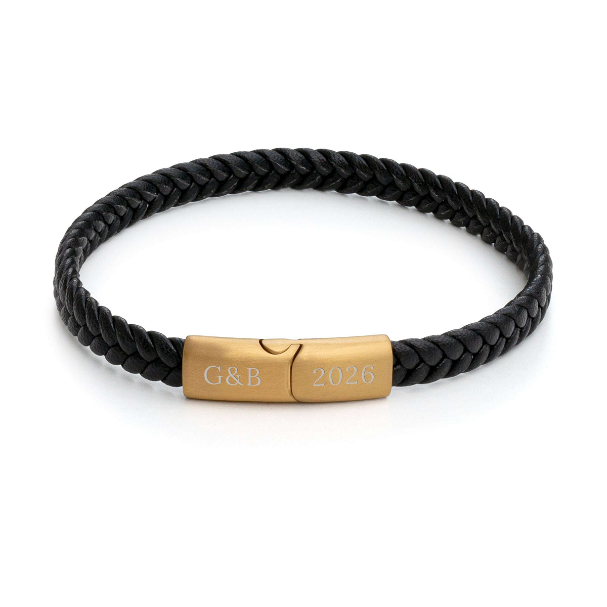 A black braided leather bracelet with a polished gold-tone metal clasp engraved with 'G&B' and '2026', shown on a clean white background.