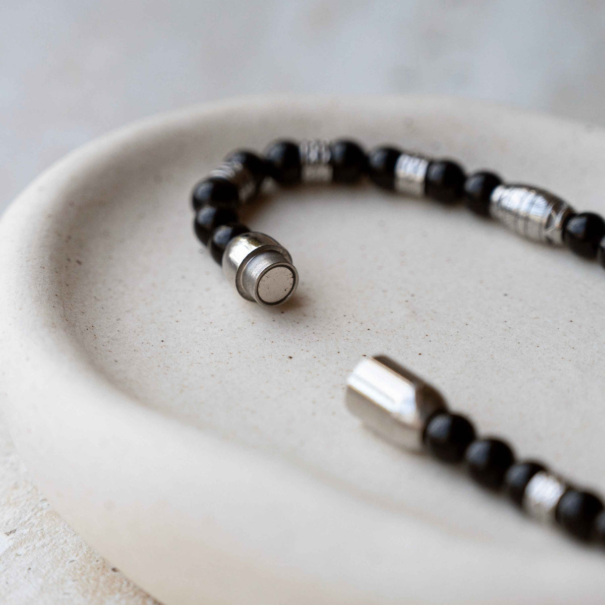Personalized Gemstone Bead Bracelet with black round beads and silver metallic spacer accents