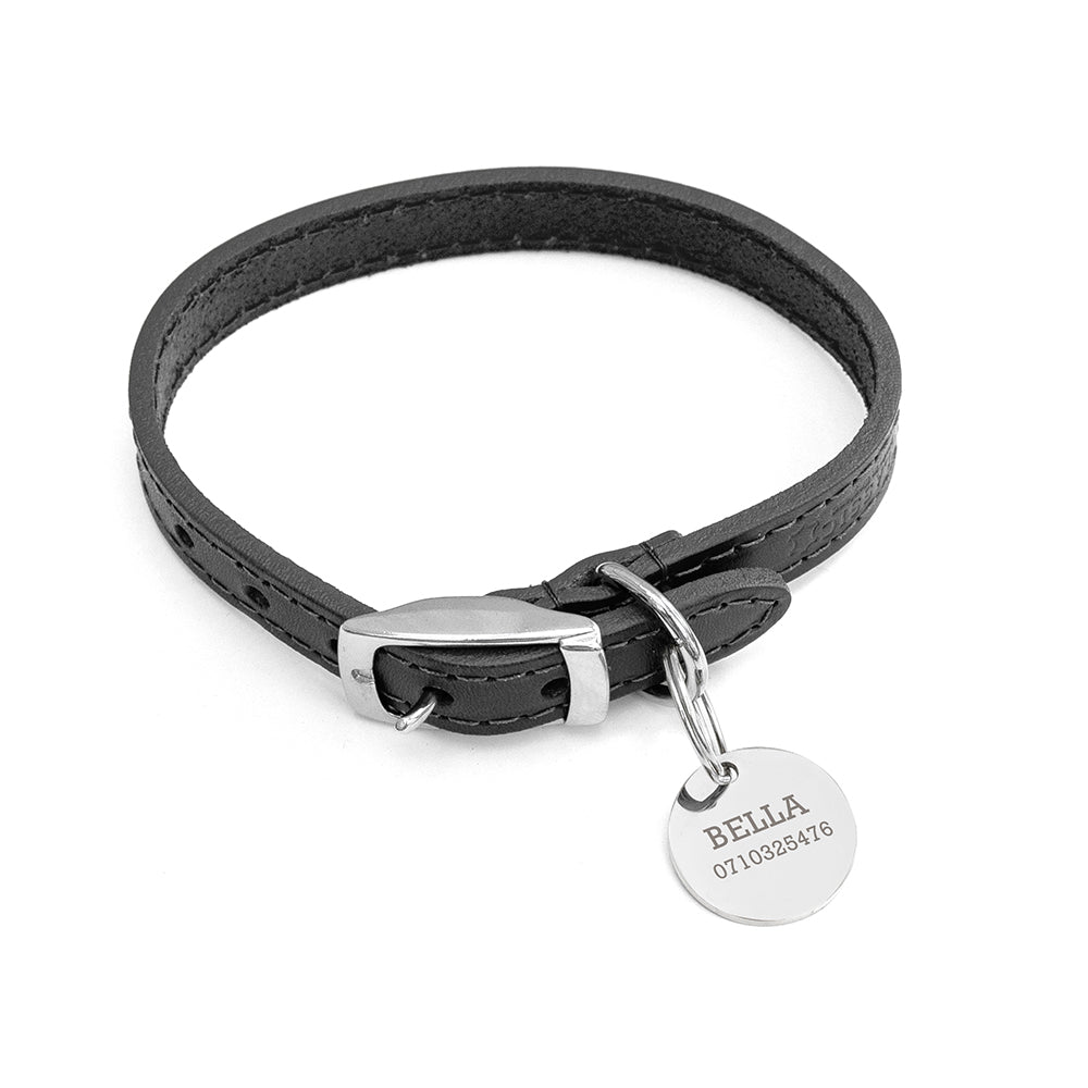 personalized leather dog collar with a silver tag on a white background