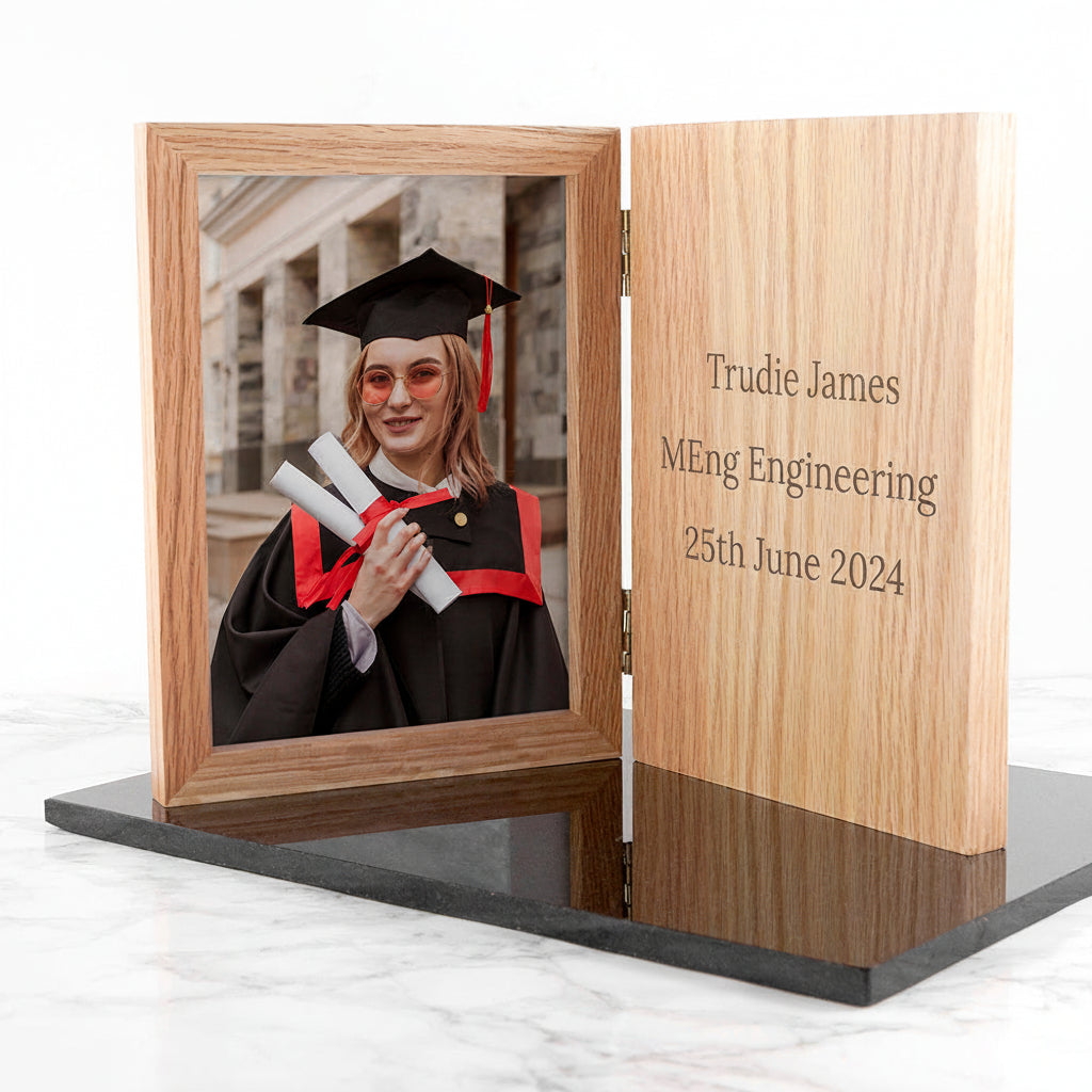 Wooden graduation photo frame with a picture of a graduate and engraved text.