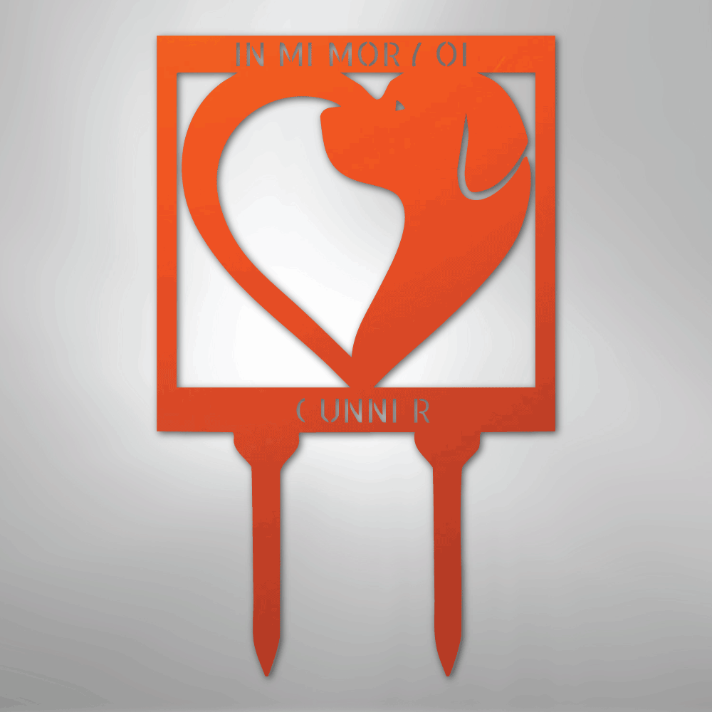Orange metal garden stake with dog silhouette and 'In Memory Of' text on a gray background