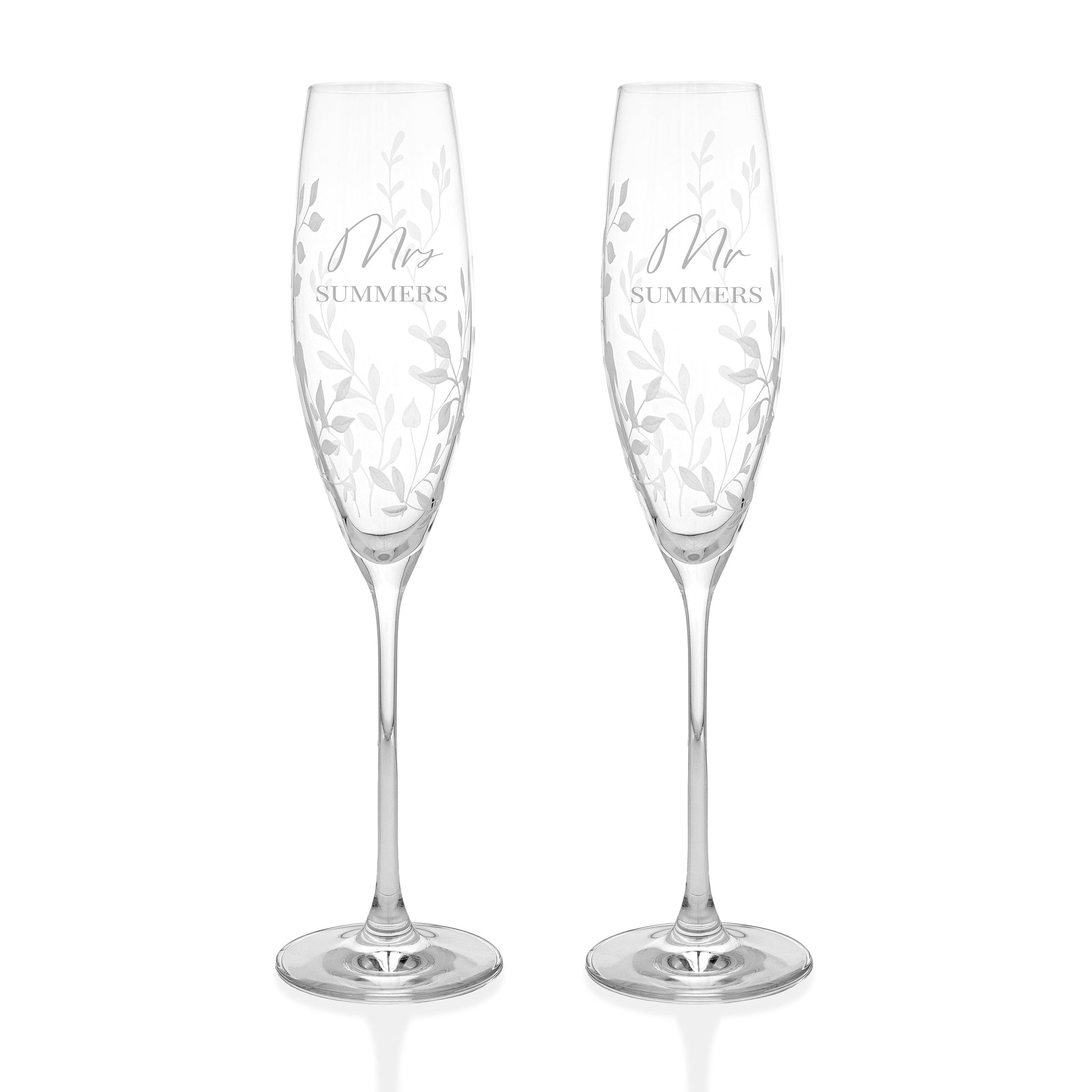 Two crystal champagne flutes-personalized with 'Mr' and 'Mrs' inscriptions 