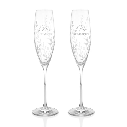Two crystal champagne flutes-personalized with 'Mr' and 'Mrs' inscriptions 