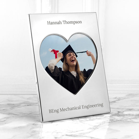 Custom-Engraved-Heart-shaped photo frame with a graduation-themed picture of a person in a cap and gown.
