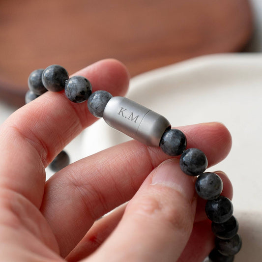 Men’s Personalized Labradorite Gemstone Bracelet engraved with the initials 'K.M'.