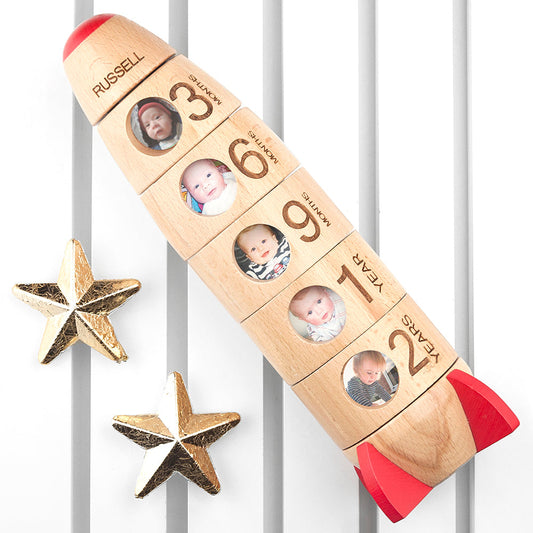 Wooden toy rocket with photo cubes