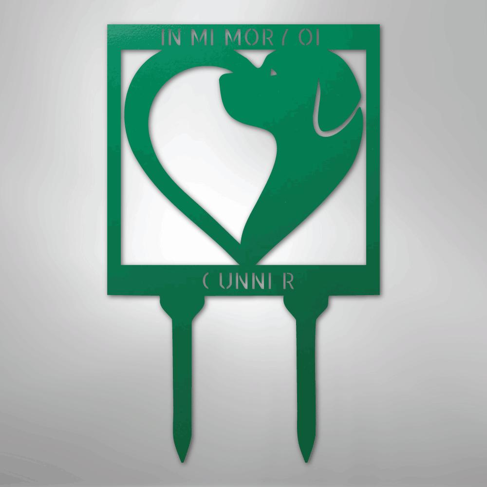 Green metal garden stake with dog silhouette and 'In Memory' text on a gray background