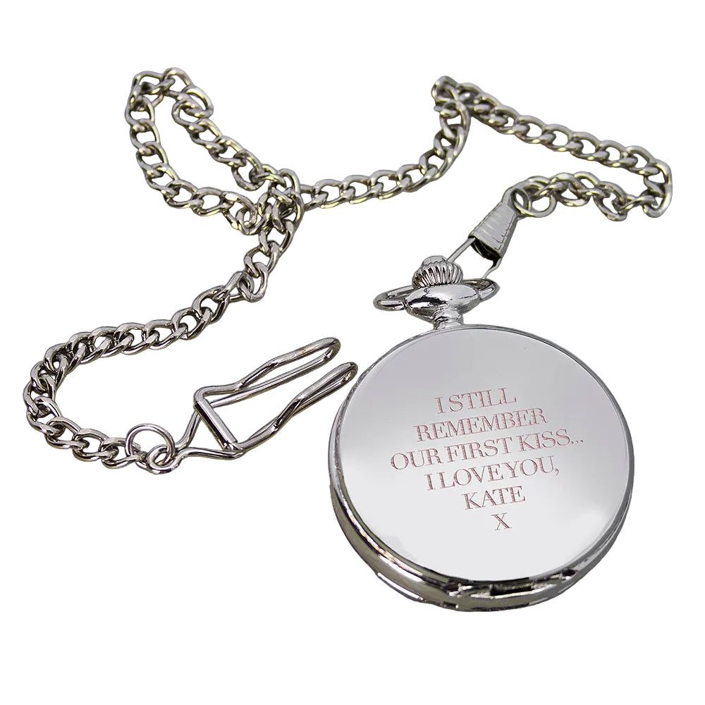 Silver locket with engraved message on a stone surface