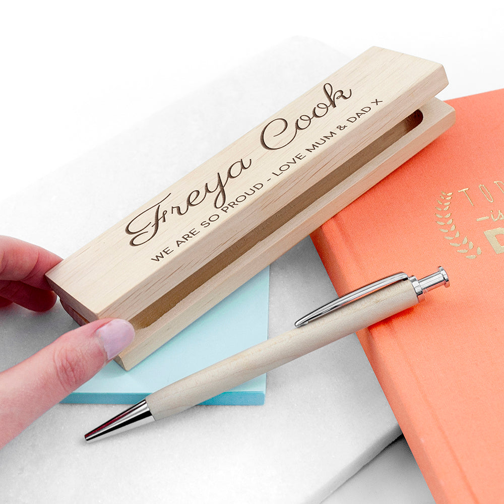 Personalized wooden pen case with a pen on a white background