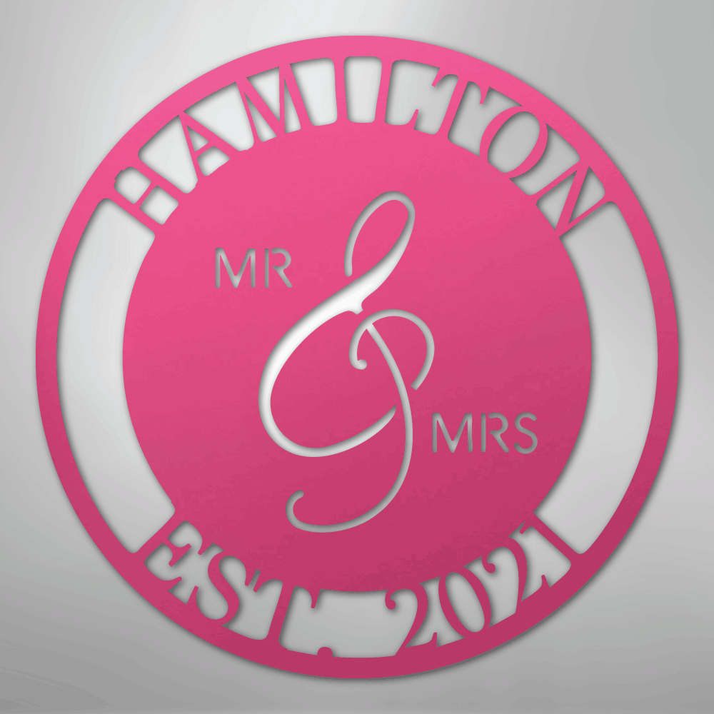 Decorative wall art with 'Hamilton' and 'Mr & Mrs' text on a pink and silver background